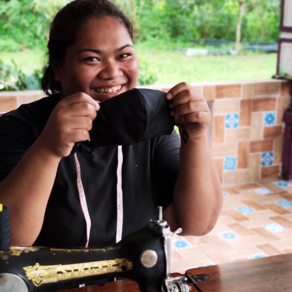 Orang Asli ladies making masks